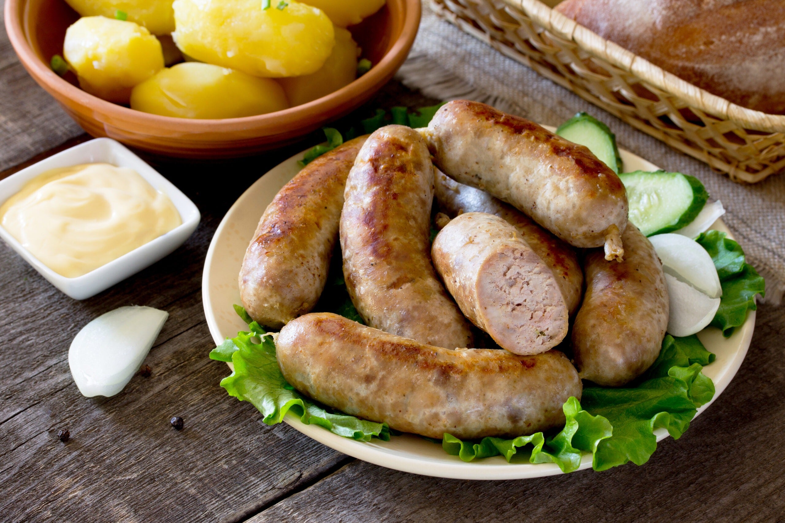 bratwurst sausage, vegetables, herbs and boiled potatoes
