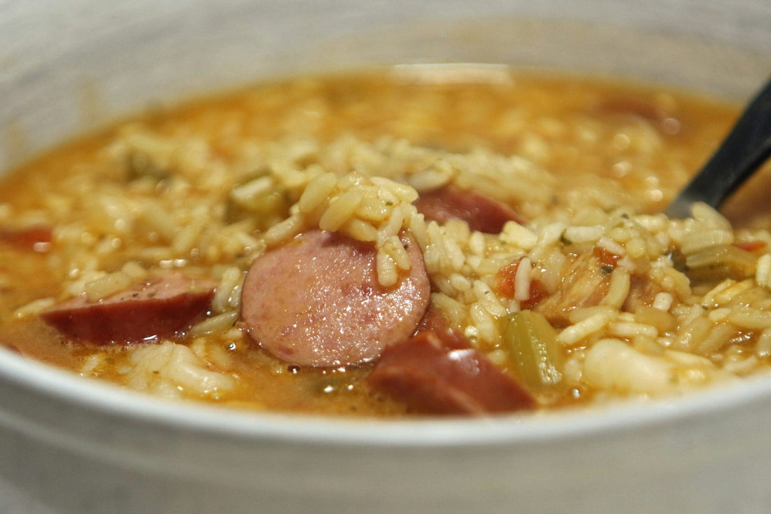 Bowl of gumbo with sliced andouille sausage and rice