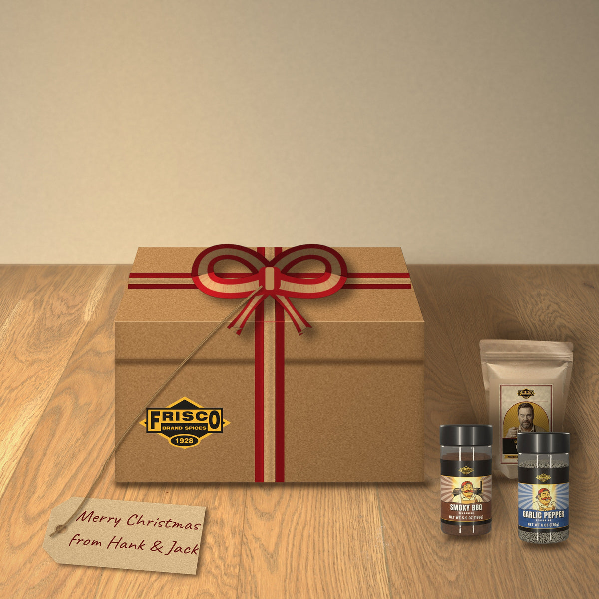 Jack's Smokehouse Gift Box: tied with a red and kraft ribbon on a wood table, with a 'Merry Christmas from Hank & Jack' tag
