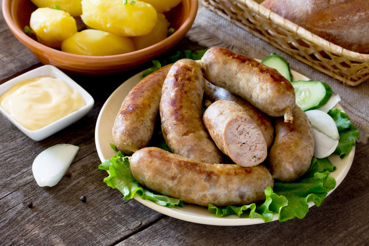 bratwurst sausage, vegetables, herbs and boiled potatoes