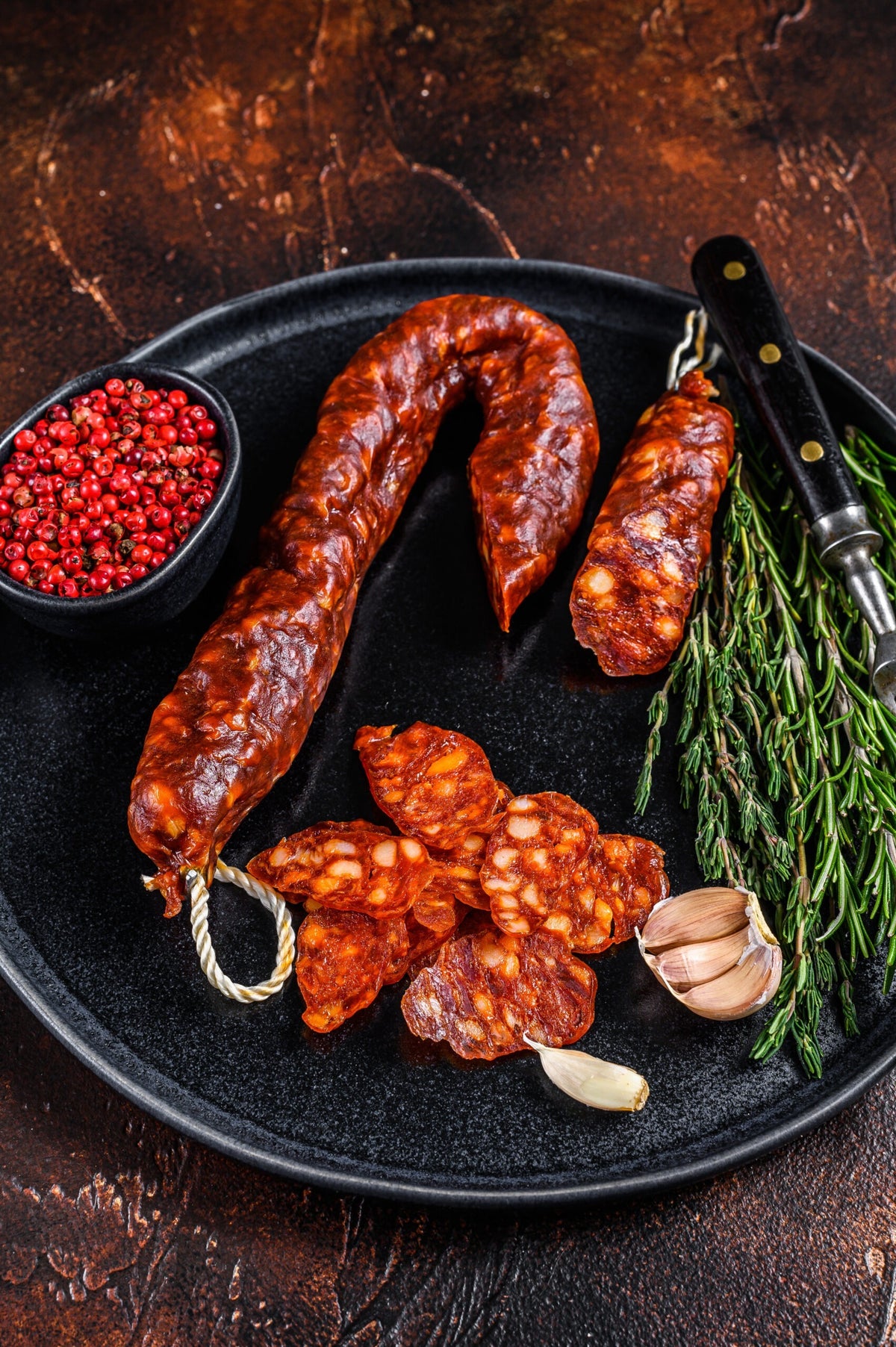 Spanish traditional tapas Sliced chorizo pork dry cured sausage.