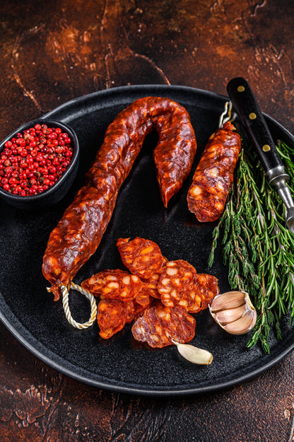 Spanish traditional tapas Sliced chorizo pork dry cured sausage.