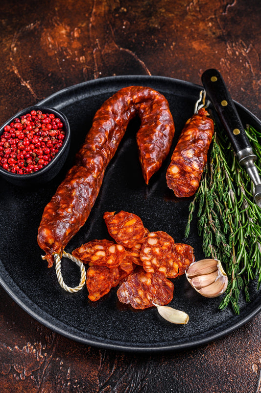 Spanish traditional tapas Sliced chorizo pork dry cured sausage.